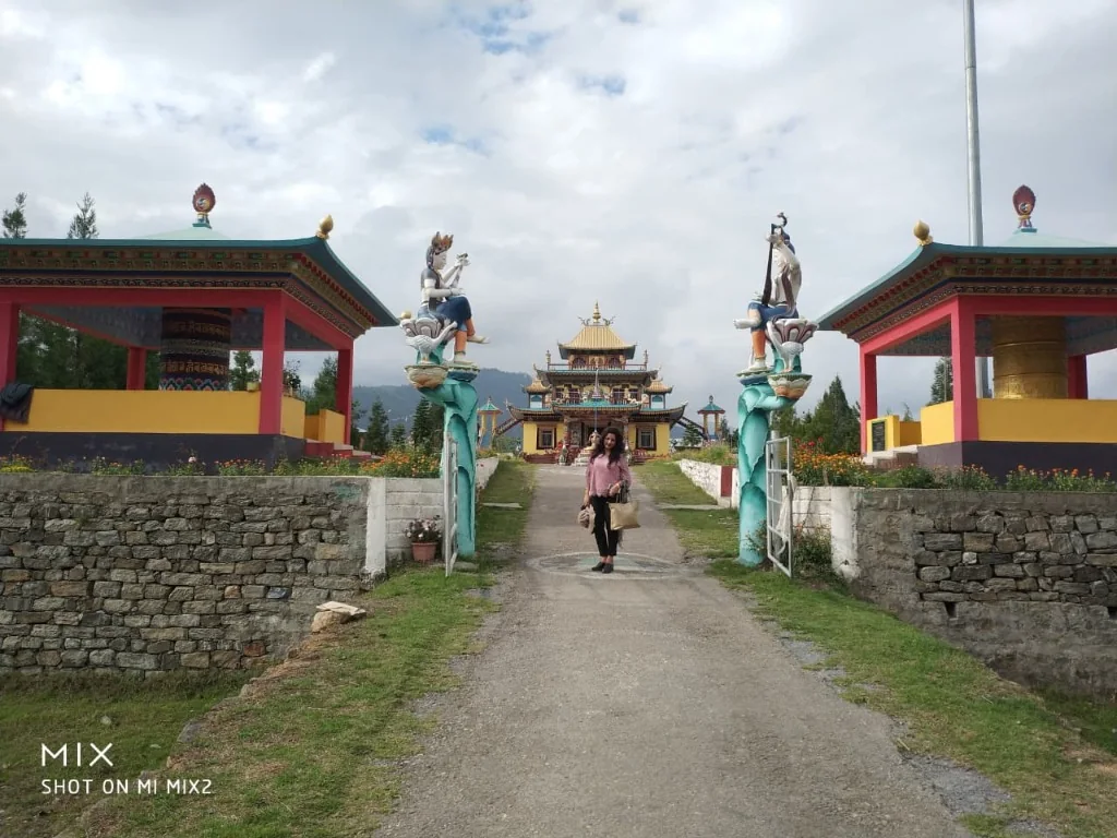 Entrance pathway flanked by prayer wheel pavilions leading to Chillipam Monastery