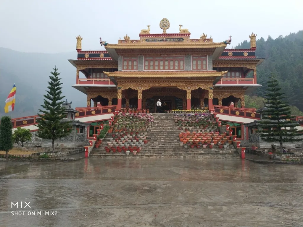 Grand flower-adorned staircase leading to Thupsung Dhargye Ling Monastery in Dirang