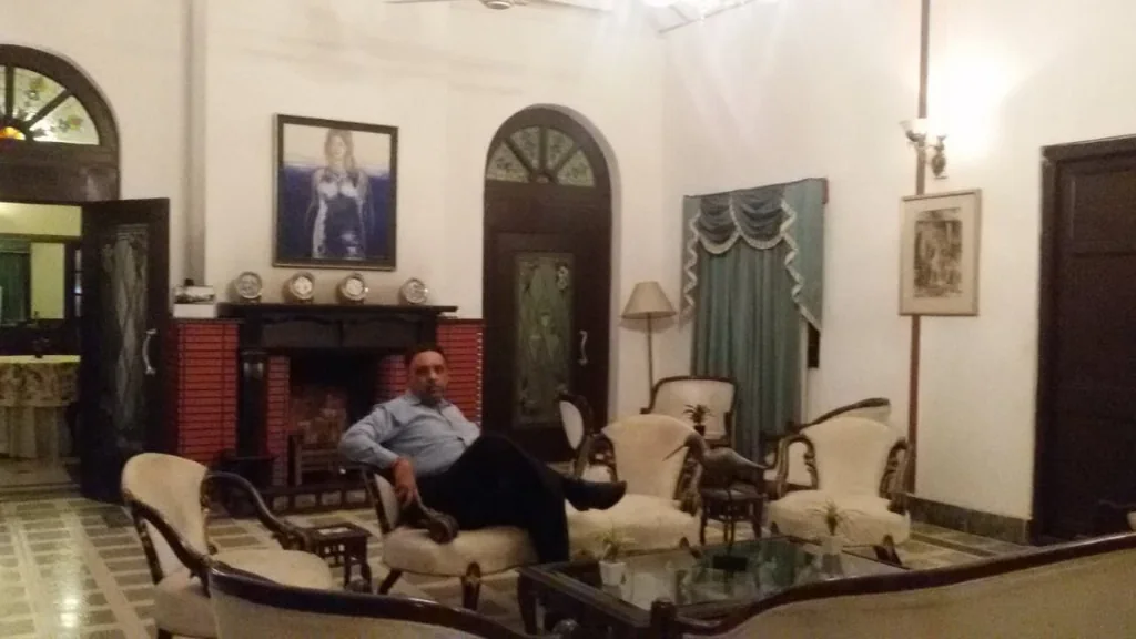 Gentleman sitting in the colonial tea bungalow living room