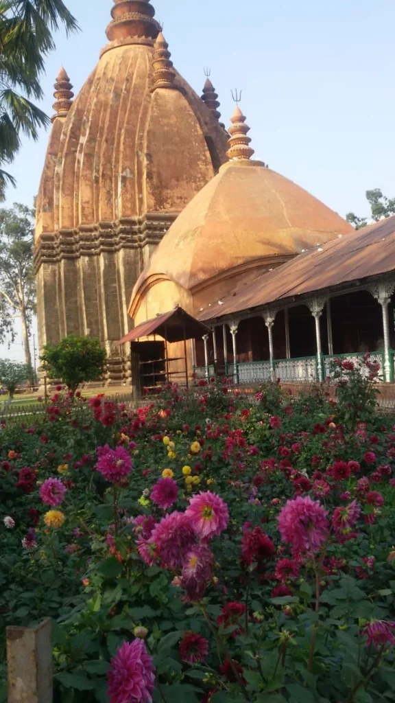Flower garden in front of Shiva Dol temple spire in Sivasagar