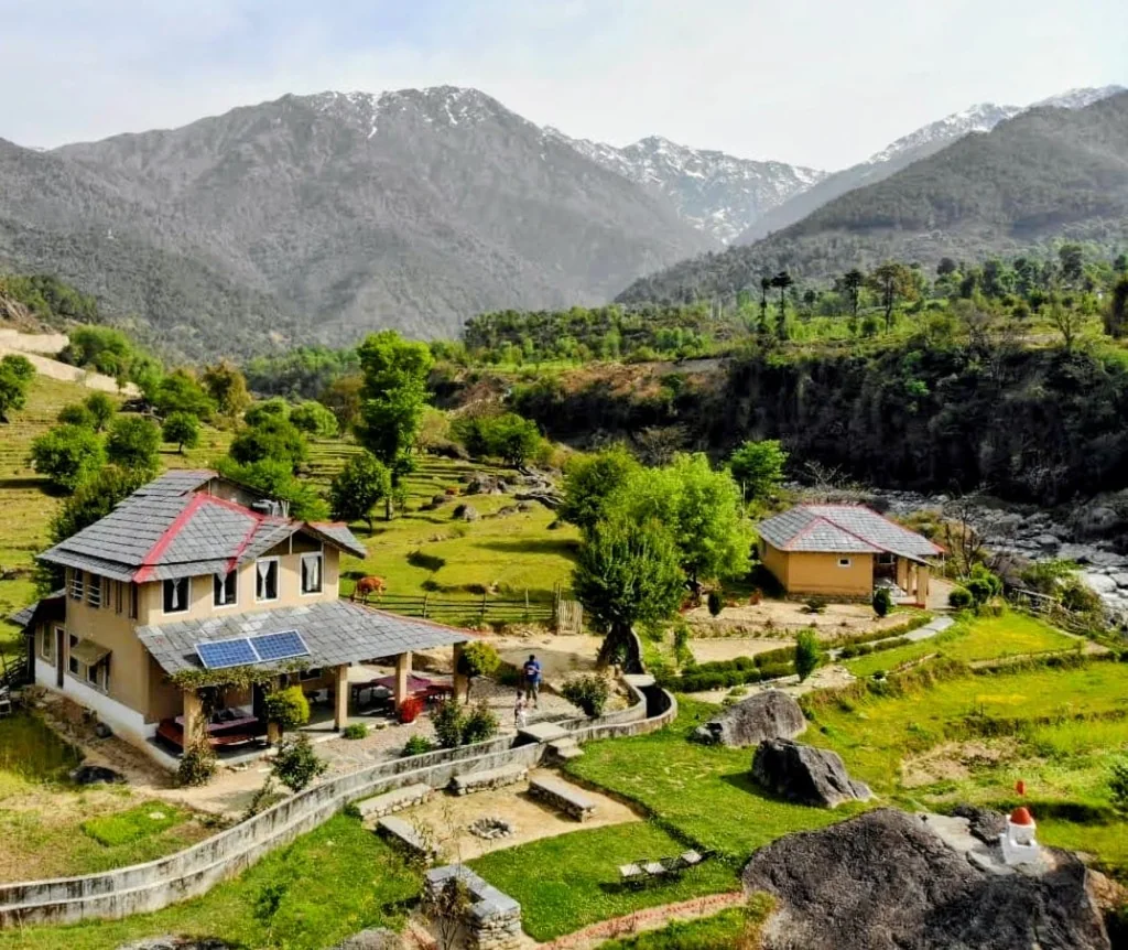 Beautiful view of Palampur showing green tea gardens and mountain slopes with local homes