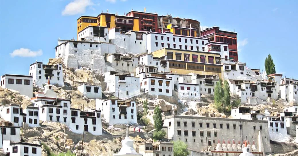 Panoramic view of the iconic Thiksey Monastery perched on a hill in Ladakh.