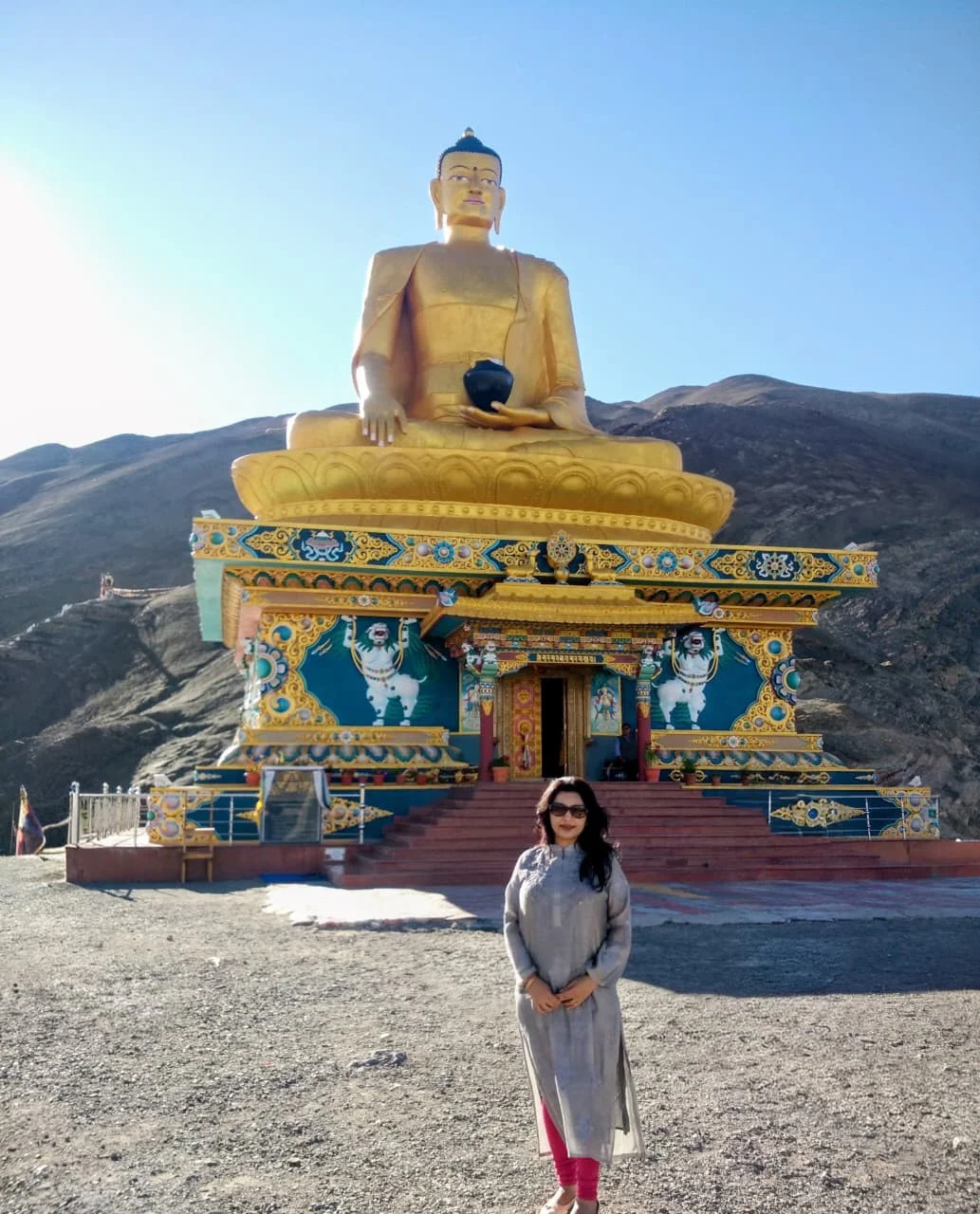 Standing in front of the Maitreya Buddha statue
