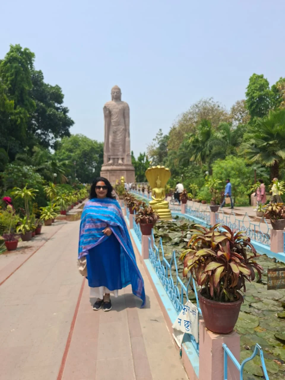 Manicured gardens and pathways around the massive marble temple complex