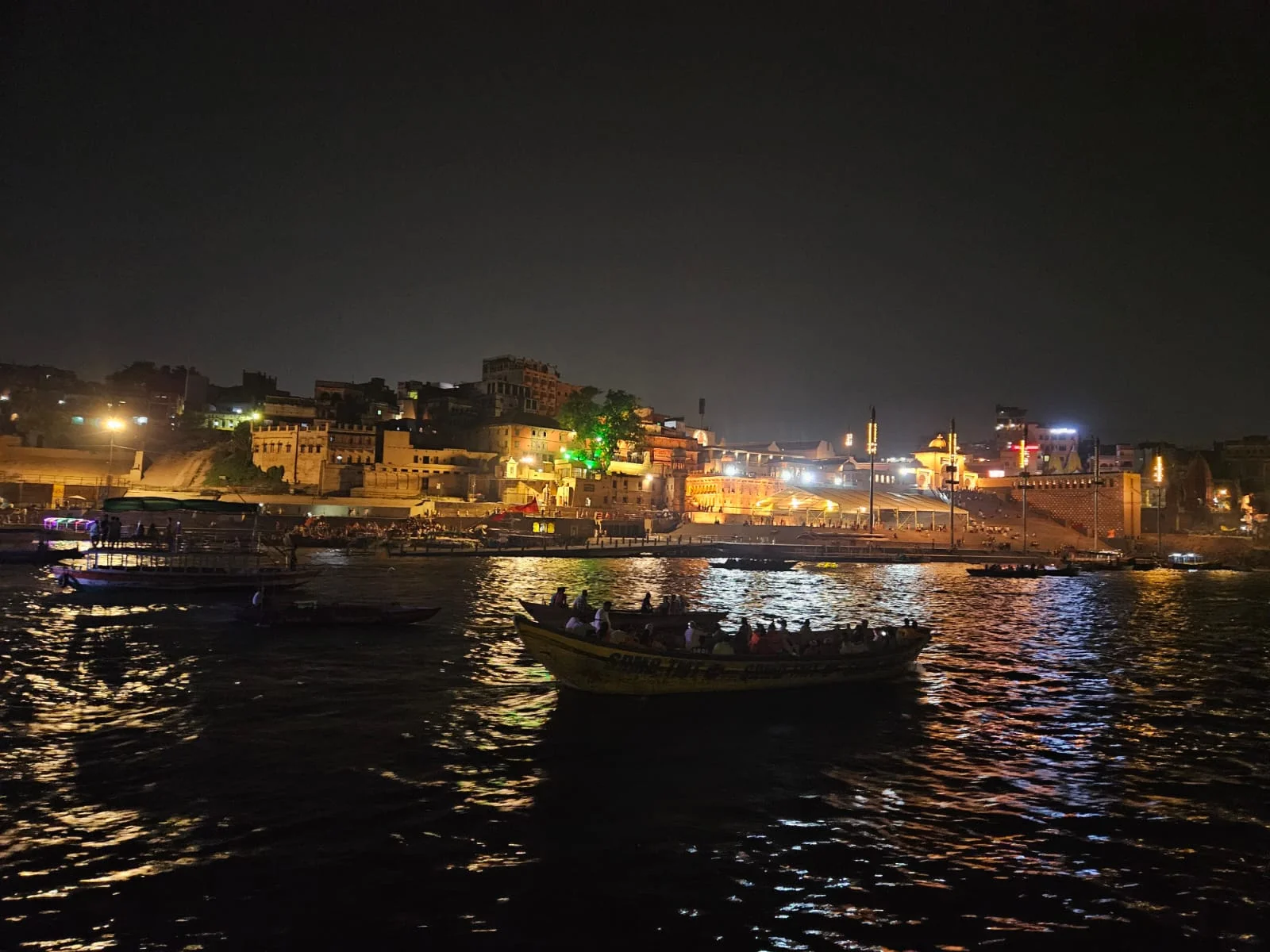 Devotees gathering at ASSI Ghat for morning prayers and early rituals