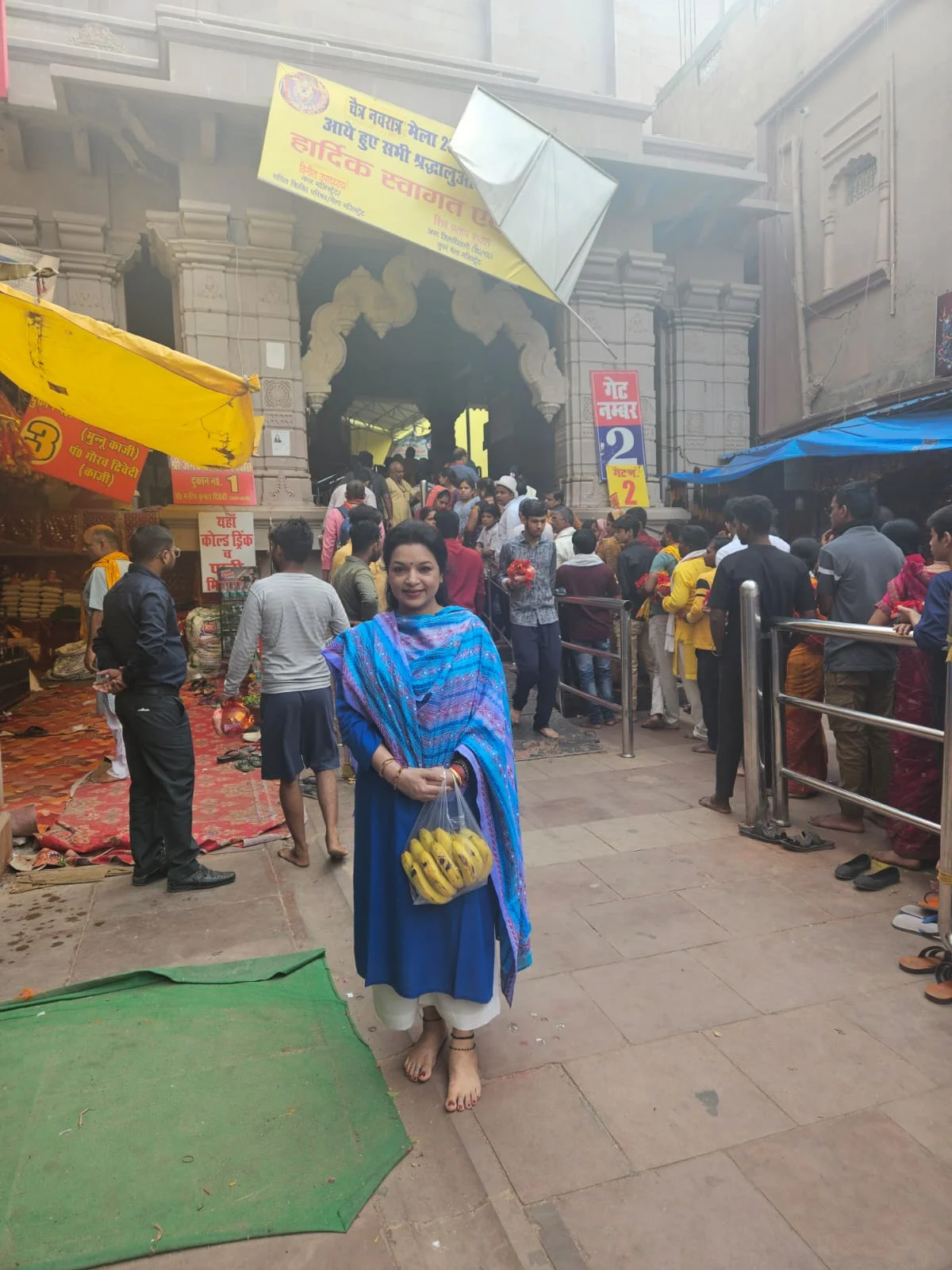 Ornate marble details and landscaped pathways leading up to the Mahamandir entrance