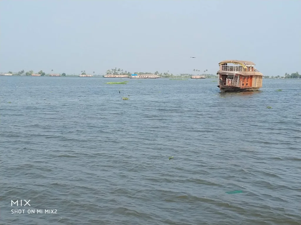 Kerala houseboat drifting through Kumarakom backwaters