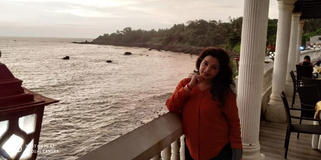 Walking on rocky coastal shore at low tide in Kannur