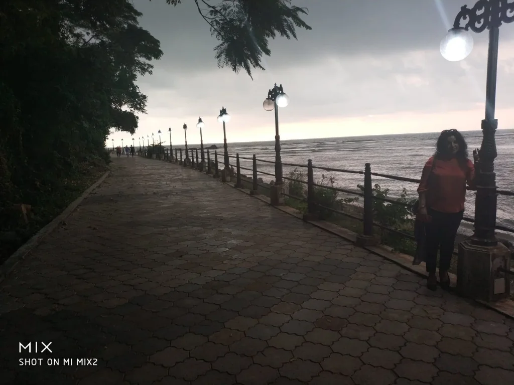 Evening promenade with illuminated street lamps overlooking Malabar coast