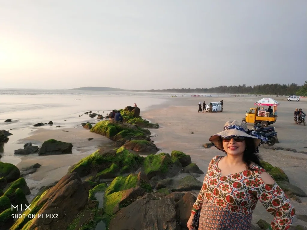 Muzhappilangad drive-in beach with green moss rocks in Kannur