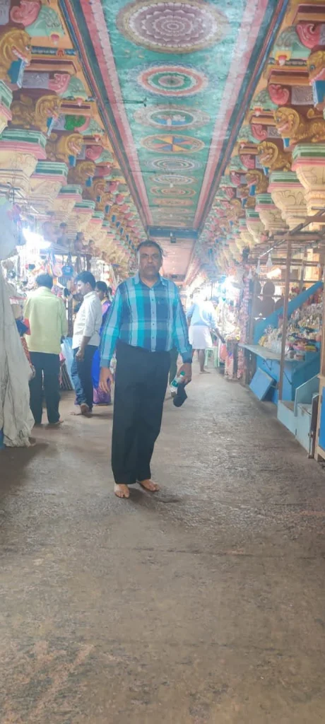 Intricately carved outer corridor and painted lotus ceilings at Ramanathaswamy Temple