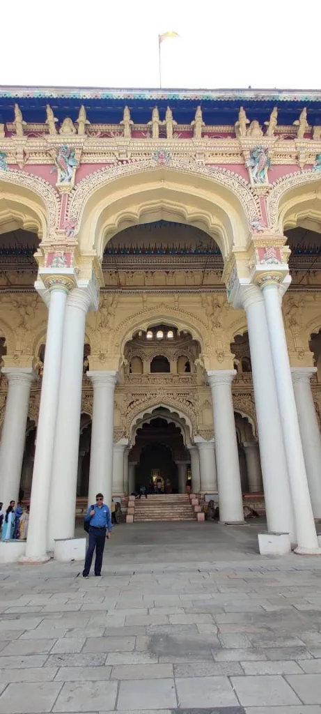 Ornate facade and colossal white pillars of Thirumalai Nayakkar Mahal