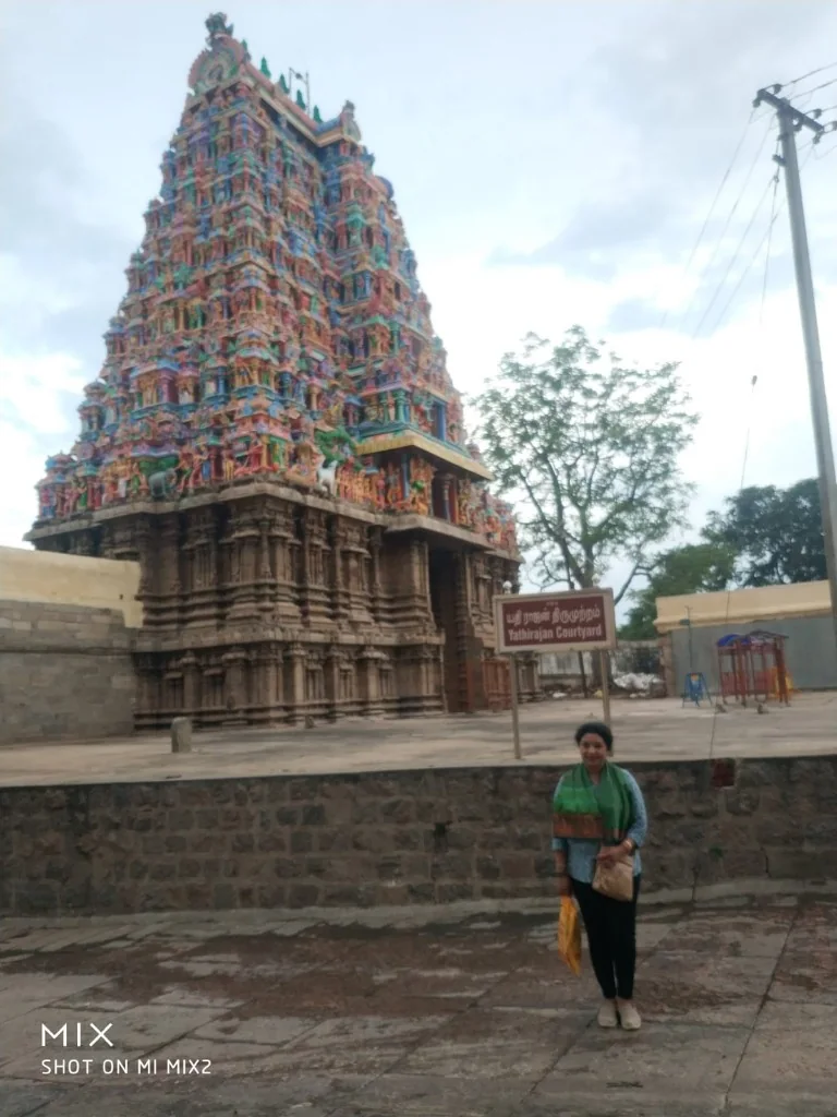 Towering colorful gopuram of Thirupparankundram Temple at Yathirajan Courtyard