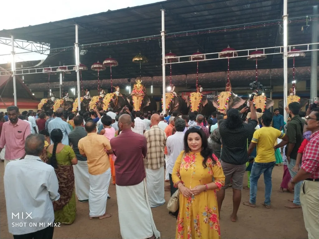 Lady taking a selfie with the elephants