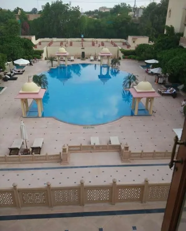 Swimming pool courtyard at Taj Hari Mahal in Jodhpur with Rajput-inspired arches