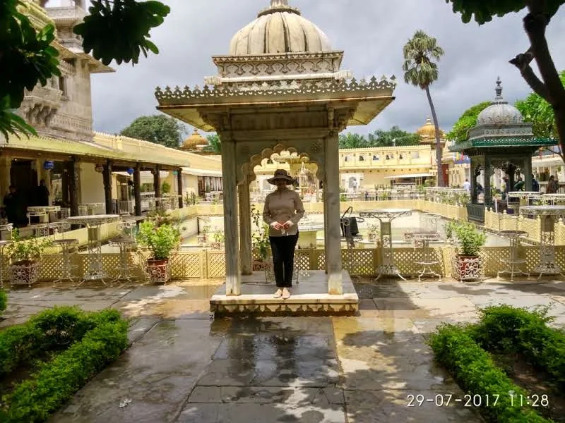 White marble Chhatri pavilion in the lush inner garden courtyard of Jag Mandir Palace