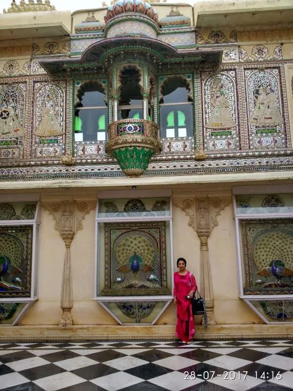 Intricate peacock glass mosaic inlays and mirror-work balconies at Mor Chowk inside Udaipur City Palace
